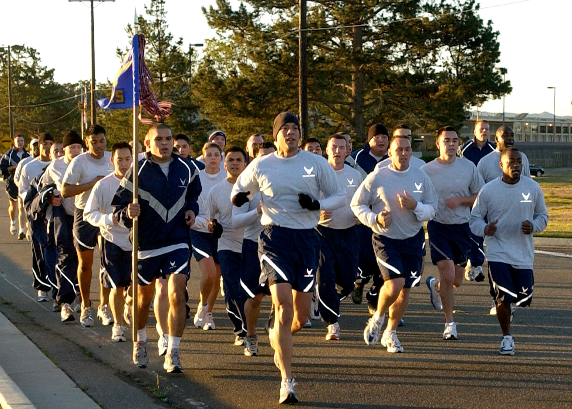 Members of the 30th Logistics Readiness Squadron run in formation during the 30th Space Wing's monthly Fit to Fight run December 7, 2006 here. The five-kilometer run takes place on the first Thursday of every month.  (U.S. Air Force photo by Airman 1st Class Stephanie Longoria)