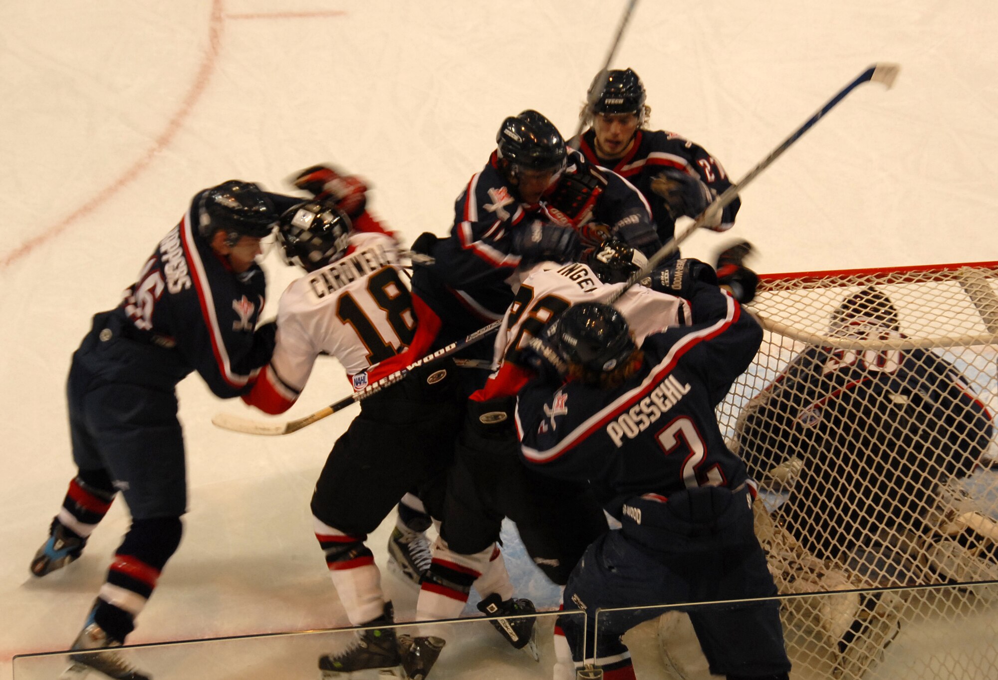 Members of the Wichita Falls Wildcats and the Sante Fe Roadrunners get into a scuffle Dec. 8. (U.S. Air Force photo/Mike Litteken.)