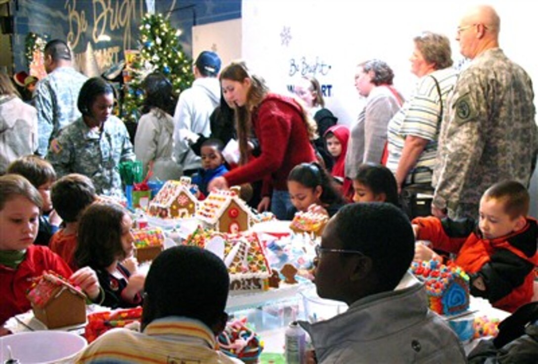 Military families build gingerbread houses during Operation Christmas at the Texas National Guard Armory in San Antonio, Dec. 13, 2006. Operation Christmas is an outreach program to help support military families during the holiday season.
