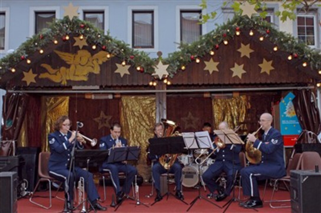 The U.S. Air Forces in Europe five star brass quintet plays for the crowd at the christmas market in Kaiserslautern, Germany, Dec. 7, 2006. The market is held every year and packs the streets with market stalls, atmospheric lights and Christmas decorations.