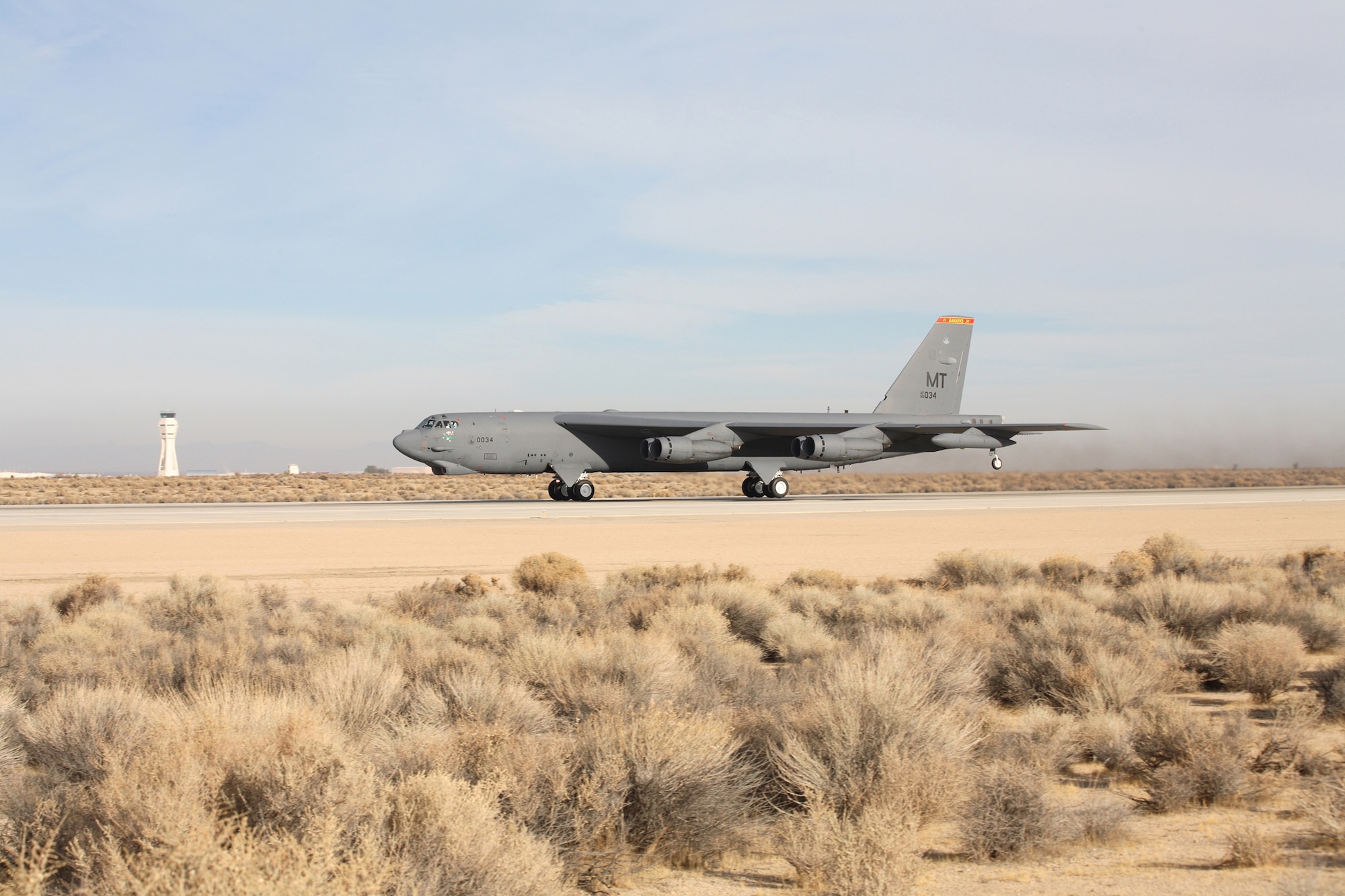A B-52 Stratofortress accelerates down the runway at Edwards Air Force Base, Calif., Dec. 15 during take-off for a flight-test mission using a blend of synthetic fuel and JP-8 in all eight engines.  This is the first time a B-52 has flown using a synfuel-blend as the only fuel on board.  In September, the Air Force successfully flew a B-52 with two-engines using the synfuel-blend while the others used standard fuel. The B-52 test flights at Edwards are the initial steps in the Air Force process to test and certify a synthetic blend of fuel for its aviation fleet. (U.S. Air Force photo/Jet Fabara)