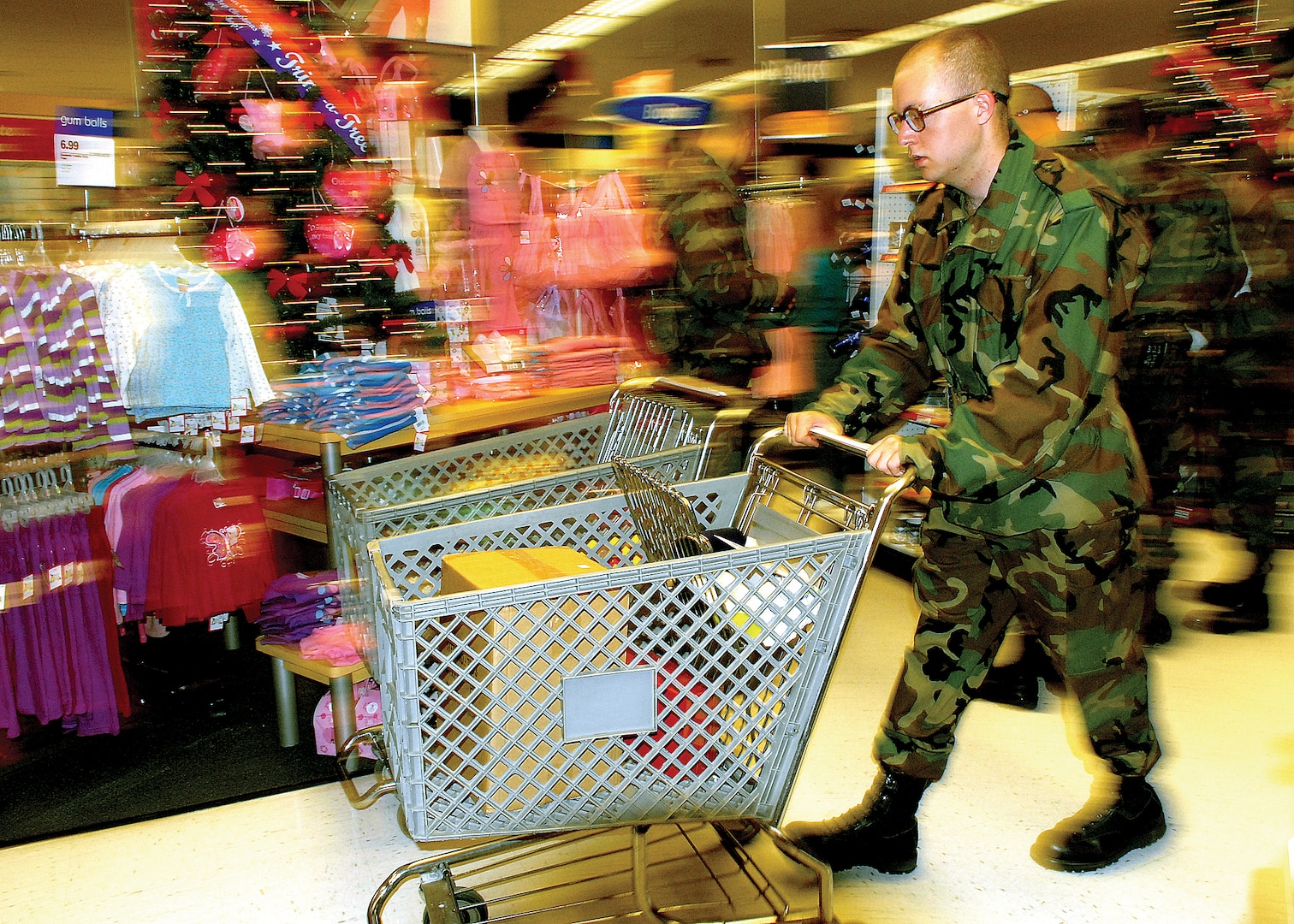 A basic trainee rushes through the Main Exchange at Lackland Air Force Base, Texas, Dec. 9 to shop for holiday gifts.