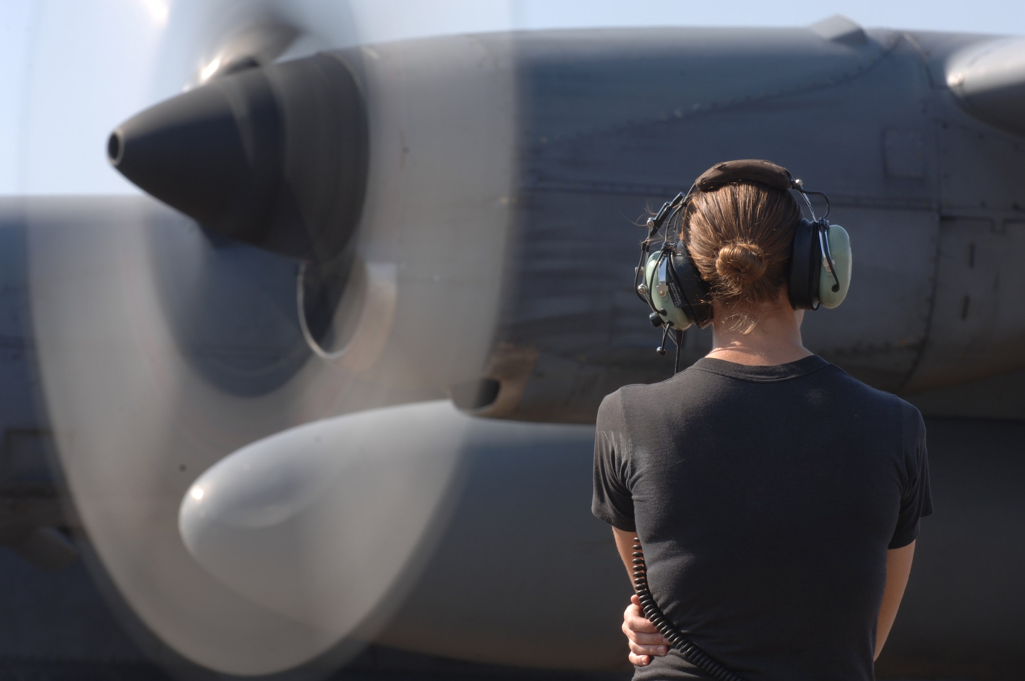Tech. Sgt. Ginger Forsyth monitors the performance of a newly repaired C-130 Hercules engine that had a new valve housing installed Dec. 13 at Camp Lemonier, Djibouti. The repair enabled delivery of supplies into Nairobi the following day. Sergeant Forsyth is a C-130 crew chief deployed from Dyess Air Force Base, Texas. Airmen assigned to the Combined Joint Task Force - Horn of Africa help prevent conflict, promote regional stability and protect coalition interests in order to prevail against extremism. More than 1,500 people from each branch of the U. S. military, civilian employees, coalition forces and partner nations make up the organization. (U.S. Air Force photo/Master Sgt. Scott Wagers) 