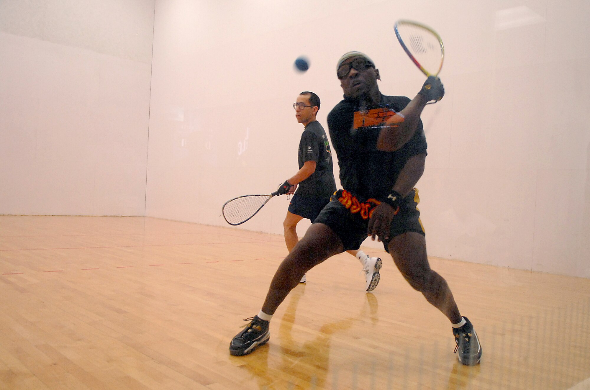 Col. Keith Moncrief, 97th Mission Support Group commander, and Tech. Sgt. Christopher Baca, a C-5 flight engineer, compete in the final game of the Racquetball Tournament Dec. 13 at the Fitness Center.  The two played three games against each other, with Colonel Moncrief taking the win, 3-1. (U.S. Air Force photo/Senior Airman Joshua DeMotts)