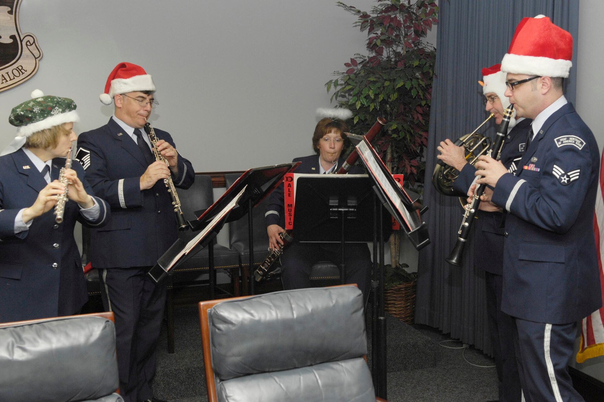 SHAW AIR FORCE BASE, S.C. -- The U.S. Air Force Langley Winds woodwind quintet perform holiday music for Shaw members  Wednesday. The Langley Winds is part of the U.S. Air Force Heritage Band of America who performed at the Sumter County Exhibition Center on Dec. 12 as a gift from Col. Bill Hyatt, 20th Fighter Wing commander, to the Sumter community for the support given to Shaw throughout the year. More than 2,100 people attended the concert. (U.S. Air Force photo/Airman 1st Class William Coleman)