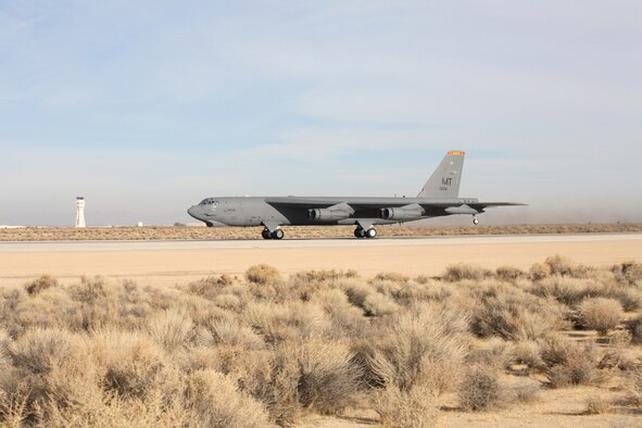 A B-52 Stratofortress accelerates down the runway Dec. 15, 2006, at Edwards Air Force Base, Calif., during take-off for a flight-test mission using a blend of synthetic fuel and JP-8 in all eight engines. This is the first time a "Buff" has flown using a synfuel-blend as the only fuel on board.  In September, the Air Force successfully flew a B-52 with two-engines using the synfuel-blend. The B-52 test flights at Edwards are the initial steps in the Air Force process to test and certify a synthetic blend of fuel for its aviation fleet.  (Photo by Jet Fabara)