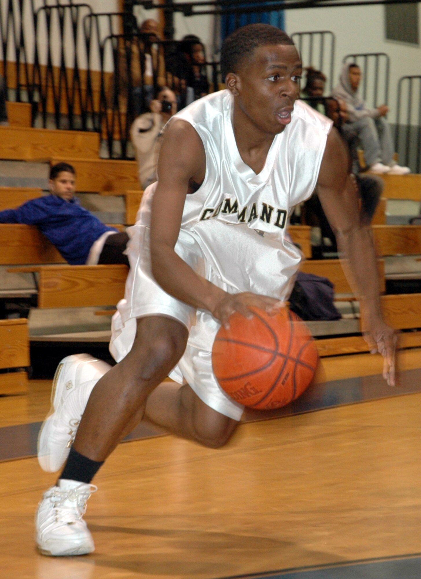 Hurlburt Commandos guard DeAngelo Gilliam breaks toward the lane against Naval Station Mayport during the varsity basketball game Dec. 9. Hurlburt won both of the weekend games 87-75 and 83-78. (U.S. Air Force Photograph by MSgt Stuart Camp)
