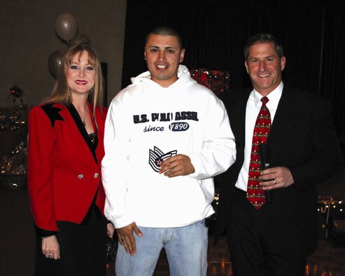 Tech. Sgt. Jason Estrada, 49th Medical Services Squadron, was asked to attend the 49th Medical Group Christmas party Dec. 8 when he was planning to stay home with his pregnant wife. While at the party, Brig. Gen. David Goldfein, 49th Fighter Wing commander, brought him in front of the party because he was wearing jeans and a sweatshirt to a semi-formal affair. The general, along with Chief Master Sgt. Marjorie McNichols, 49 FW command chief, surprised him with technical sergeant stripes as he was STEP promoted on the spot. STEP promotion is a promotion through the Stripes for Exceptional Performers program.