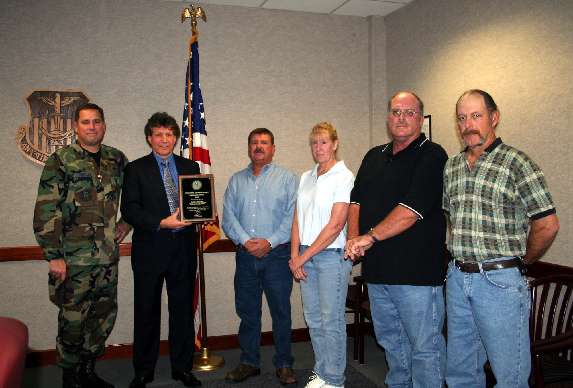 Members of the 1st Speecial Operations Civil Engineer Squadron wastewater operations plant receive the Wastewater Operations Maintenance Award. The plant won first place for EPA Region 4, and second place at the natioinal level. This is the second time the plant has received this type of recognition. In 1997, the plant won at both the EPA region 4 and EPA National level. (U.S. Air Force Photograph by SSgt Mareshah Haynes)