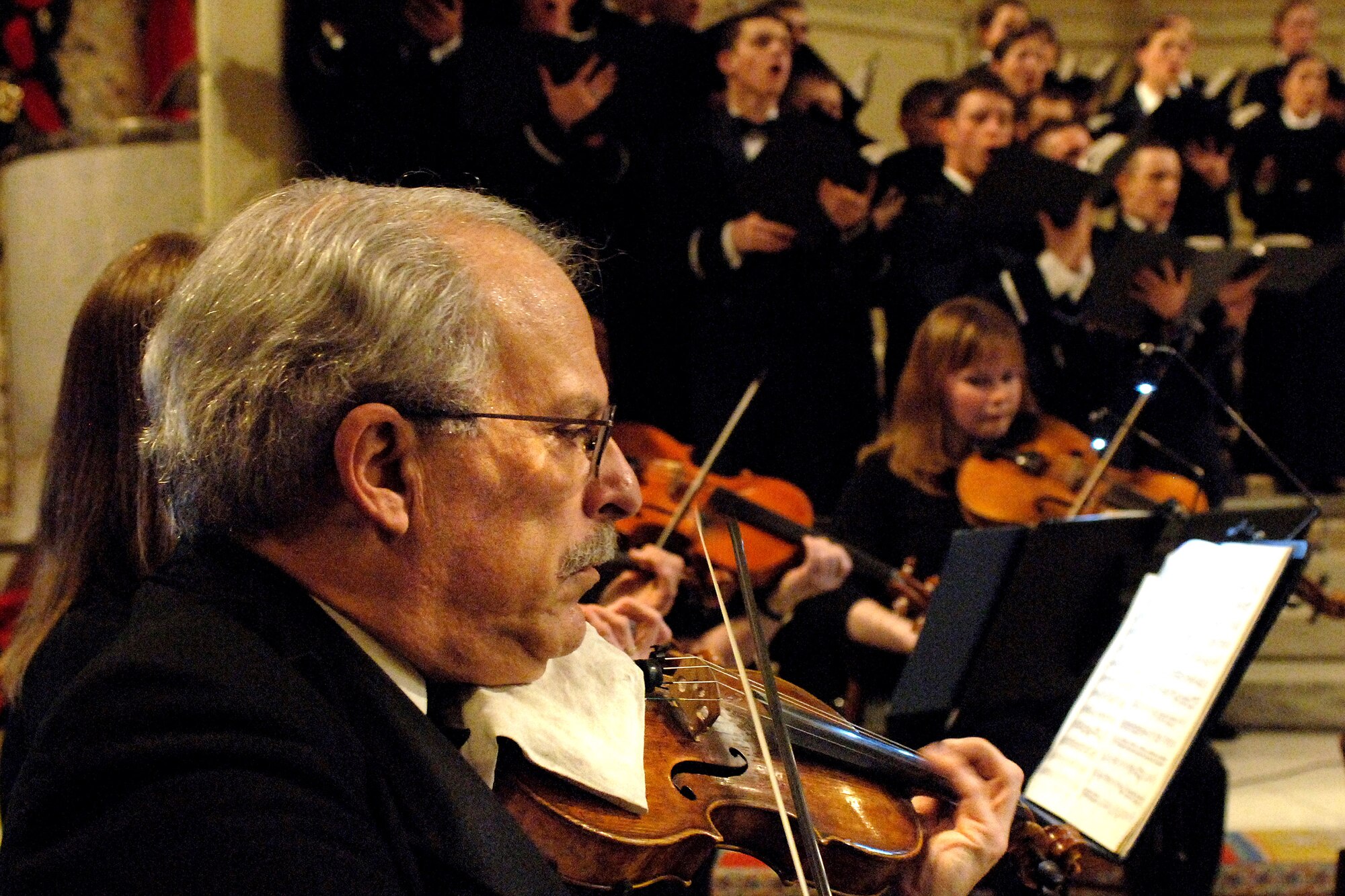 B.J. Berman performs during the annual U.S. Air Force Academy's "Messiah" concert Dec. 8 at the Cadet Chapel in Colorado Springs, Colo. The Cadet Chorale is the academy's premiere choral organization. Mr. Berman is a concertmaster violinist. (U.S. Air Force photo/Mike Kaplan) 
