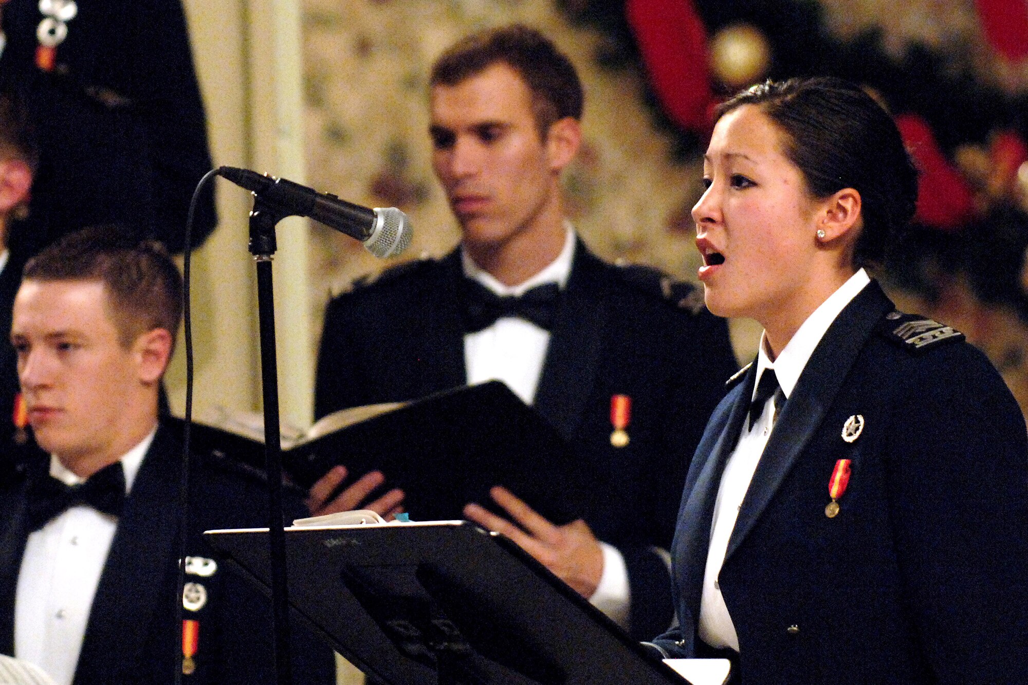 Cadet 2nd Class Deborah Gaddis performs during the annual U.S. Air Force Academy's "Messiah" concert Dec. 8 at the Cadet Chapel in Colorado Springs, Colo. Cadet Gaddis, an alto soloist, has performed as an alto soloist in the past three performances of "Messiah." The Cadet Chorale is the academy's premiere choral organization. (U.S. Air Force photo/Mike Kaplan)
