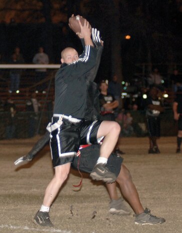 Derrick Sochor, Outlaw receiver, catches a touchdown pass during the football championship game. (U.S. Air Force photo/Staff Sgt. Marie Cassetty)
