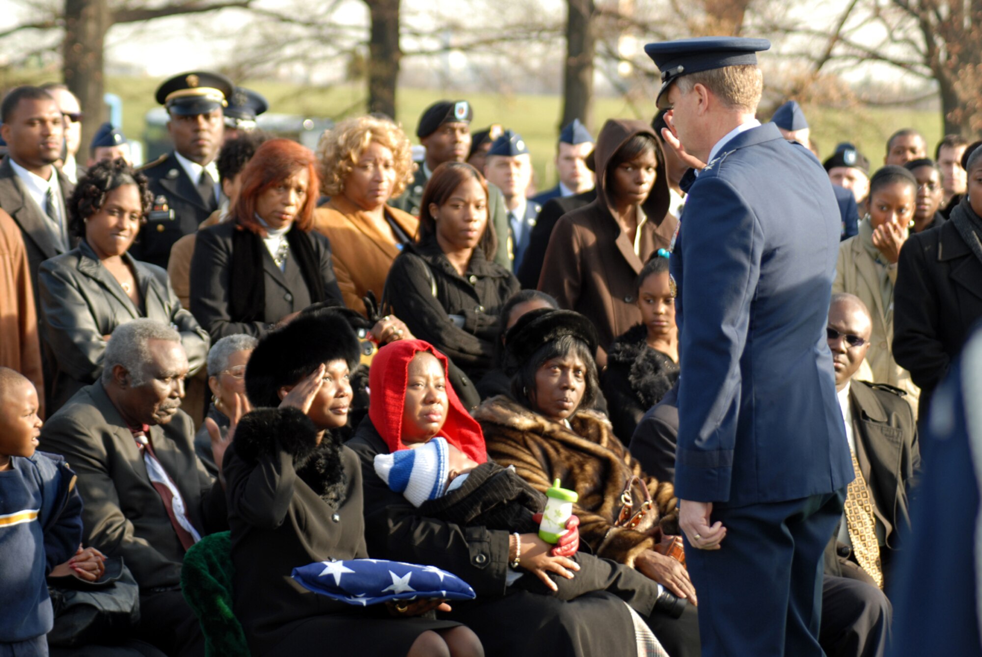 After the flag is handed to the next of kin by Maj. Gen. Delwin Eulberg, Air Force Civil Engineer, U.S. Air Force, the final salute is rendered in honor of Capt. Kermit Evans who was killed in Iraq Dec. 3, 2006. (U.S. Air Force photo by Senior Airman David Merrick)

