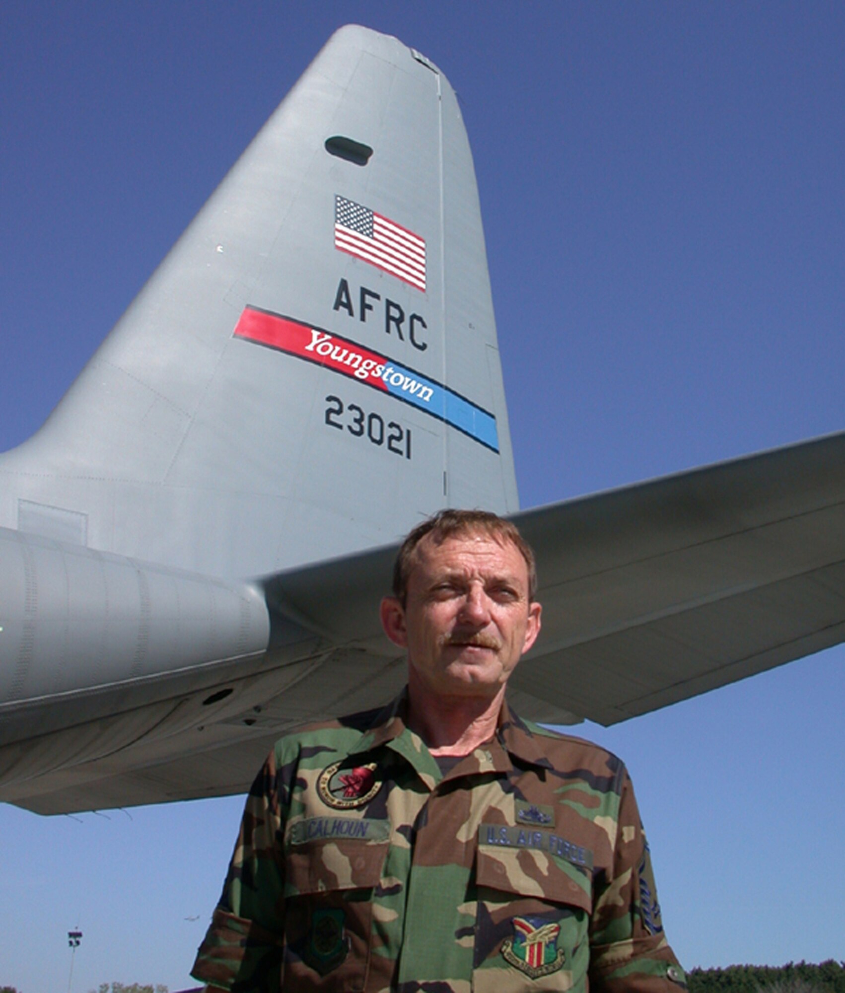 YOUNGSTOWN AIR RESERVE STATION, Ohio -- Air Force Reserve Master Sgt. Kenneth E. Calhoun, crew chief for C-130 aircraft 92-3021, retired Dec. 2, 2006 after serving his country for 28 years in three branches of the military.  His aircraft was named the "Un-Touch-A-Bull" when it was blessed by a high official of the Sioux Indian Nation in 1997.  U.S. Air Force photo/Master Sgt. Bryan Ripple.