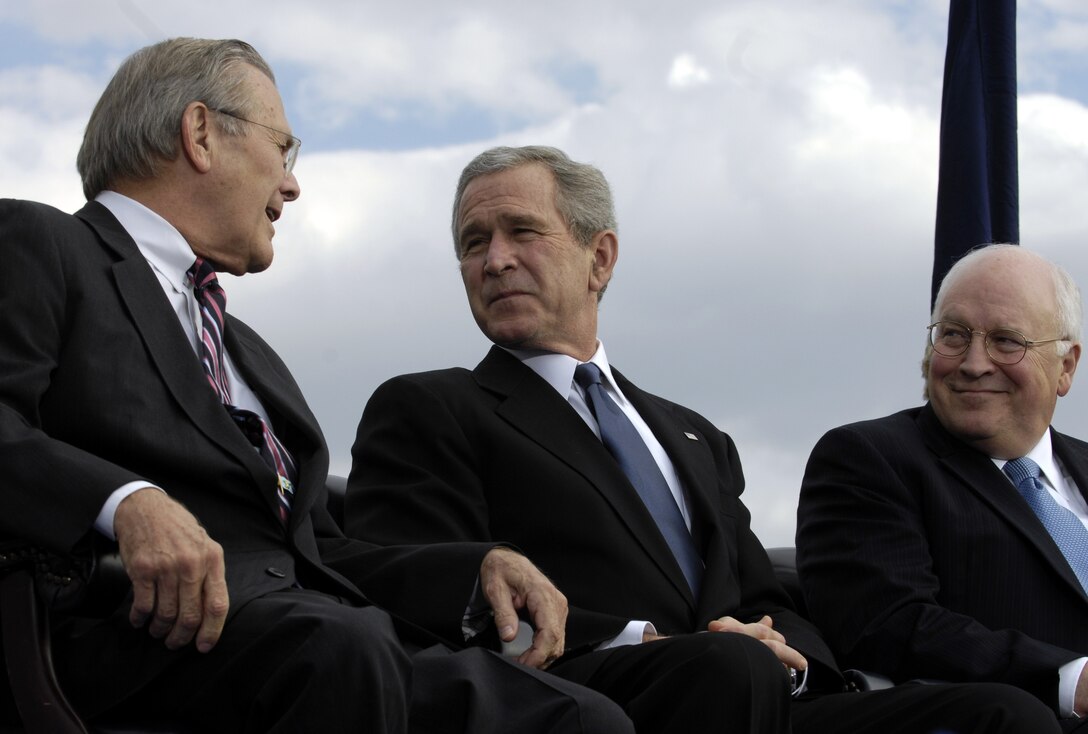 Defense Secretary Donald H. Rumsfeld shares a laugh with President George W. Bush and Vice President Dick Cheney during his farewell parade at the Pentagon, Dec. 15, 2006.