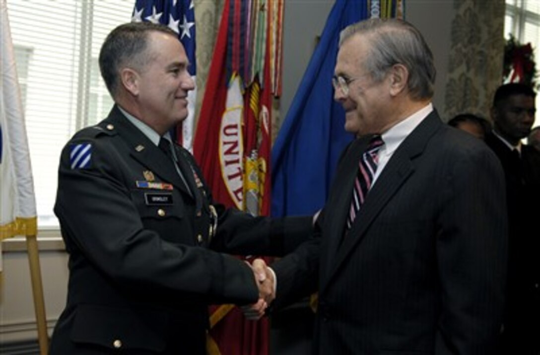 Defense Secretary Donald H. Rumsfeld hosts a promotion ceremony for U.S. Army Brig. Gen. (select) William Grimsley on their final day in office at the Pentagon, Dec. 15, 2006. Grimsley was Rumsfeld's military assistant from April through December of 2006.