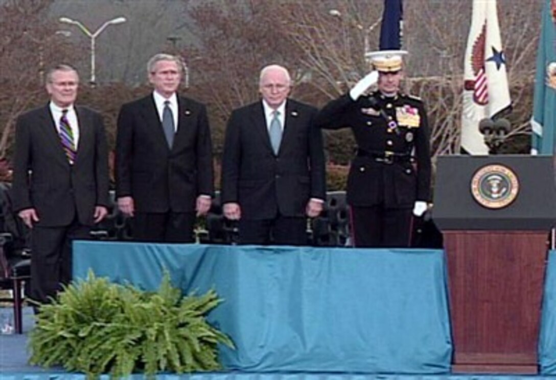 From left: Secretary of Defense Donald Rumsfeld, President George Bush, Vice President Dick Cheney, and Chairman of the Joint Chiefs of Staff Gen. Peter Pace stand at attention during the Farewell Parade for Secretary Rumsfeld at the Pentagon, Dec. 15, 2006