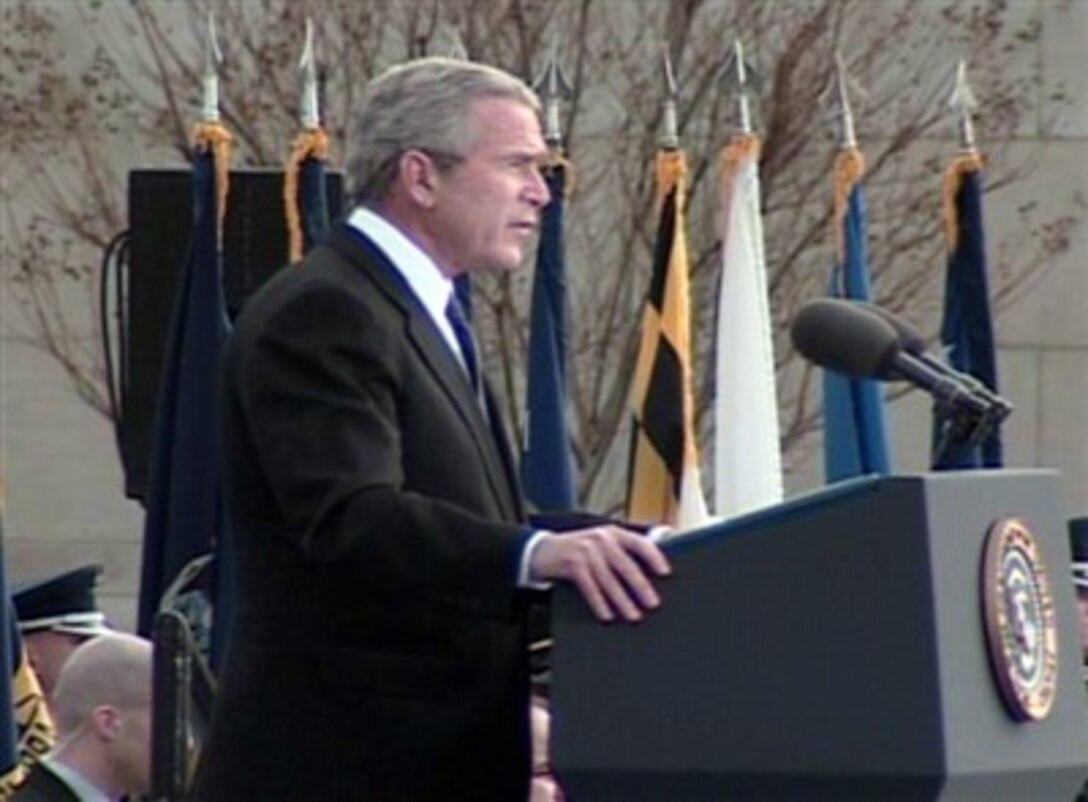 President George W. Bush speaks during the Farewell Parade for Secretary Rumsfeld at the Pentagon, Dec. 15, 2006