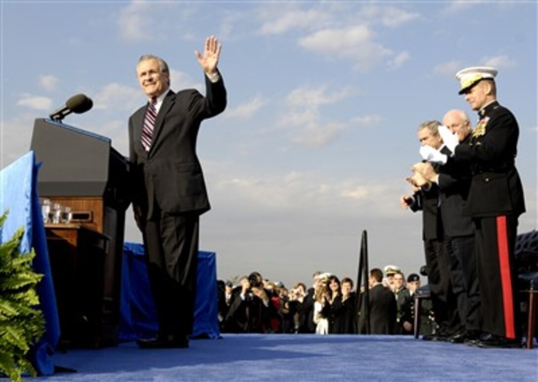 Defense Secretary Donald H. Rumsfeld, waves to the audience during his farewell parade at the Pentagon, Dec. 15, 2006.