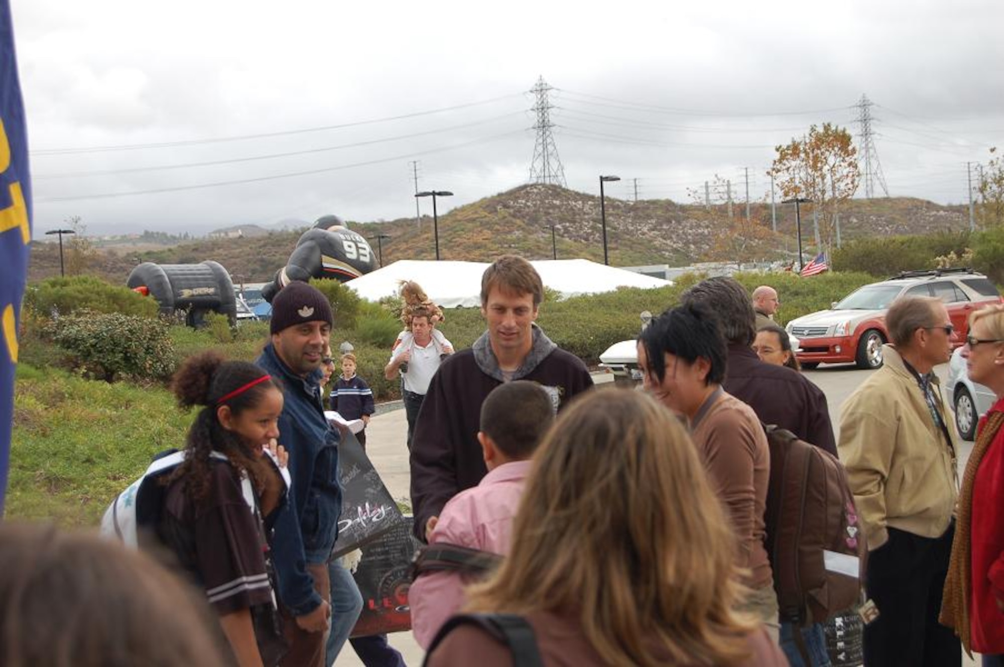Professional Skateboarder Tony Hawk chats with children during the Oakley Party Dec. 16. . The party took place during the second day of the four-day Snowball Express event. The Snowball Express final two day will include a trip to Disneyland and tickets to an Anaheim Ducks game. (U.S. Air Force photo/Staff Sgt. Jeremy Larlee)