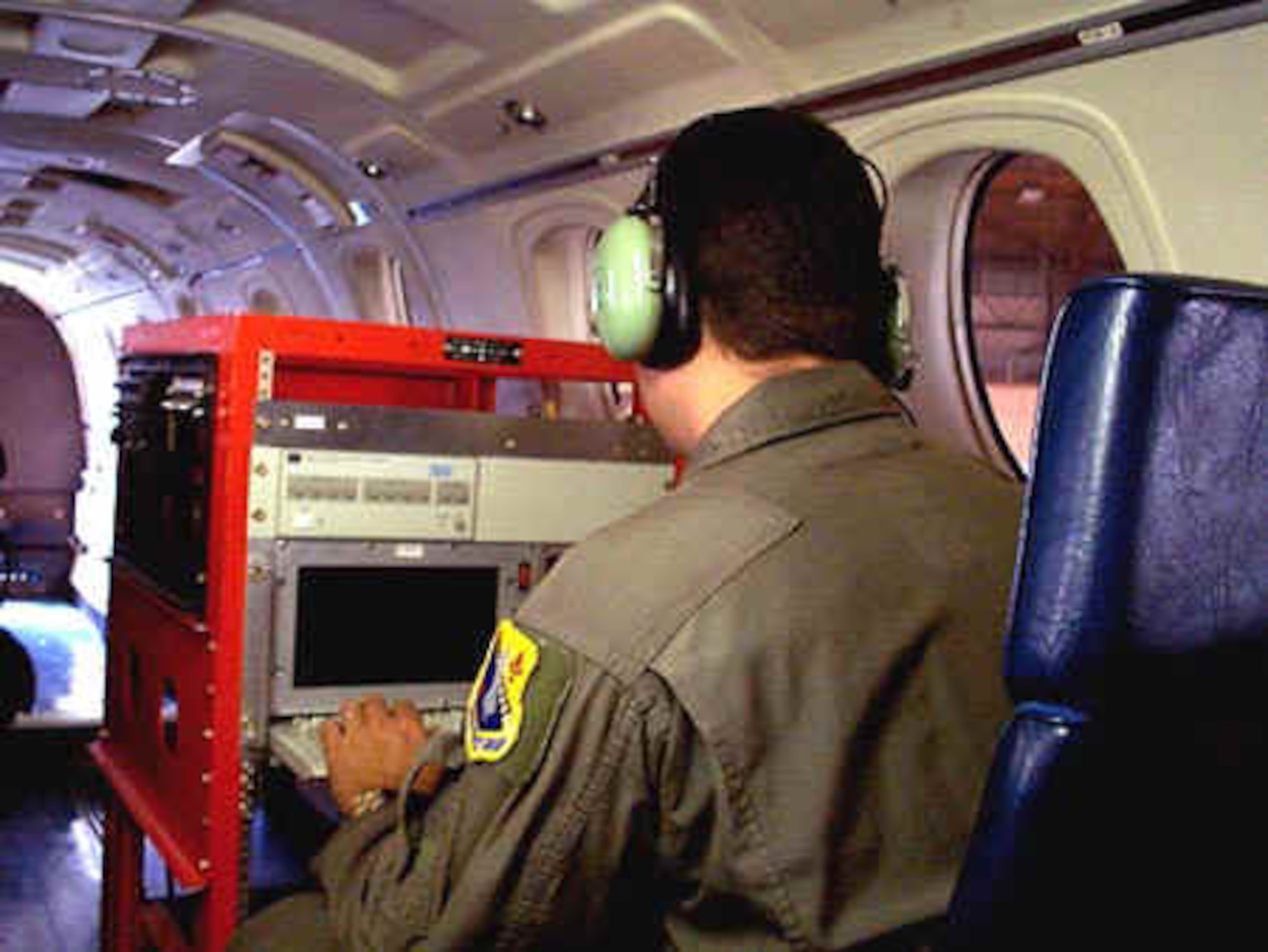 Navigation rack preflight check.  The C-12J is capable of carrying up to four fully powered, independent test racks with an operator for each rack.
