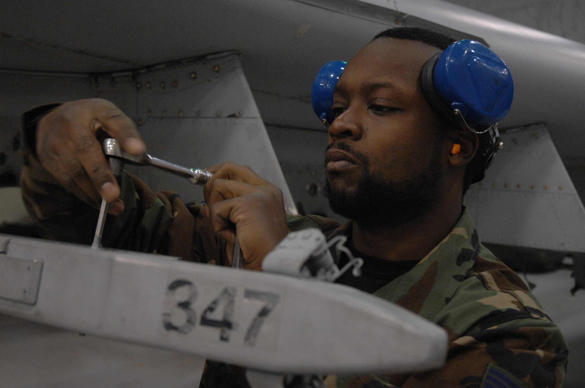 EIELSON AIR FORCE BASE, Alaska -- Senior Airman Vankeithin Simmons works on an A-10 Thunderbolt II during the Load Crew of the Quarter contest here on 15 December. The Airman represents the 355th Aircraft Maintenance Unit (AMU) and the quarterly contest pitts the 18th AMU versus the 355th AMU. Both teams loaded 2 MK-82 low drag bombs and one AIM-9 sidewinder missile to their respective aircraft.
(U.S. Air Force Photo by Staff Sgt Joshua Strang)