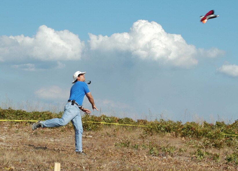 Engineering student Donald MacArthur launches his team’s entry in the Micro Air Vehicle competition held at Eglin Air Force Base, Fla.  (Air Force photo by Staff Sgt. Ryan Hansen)