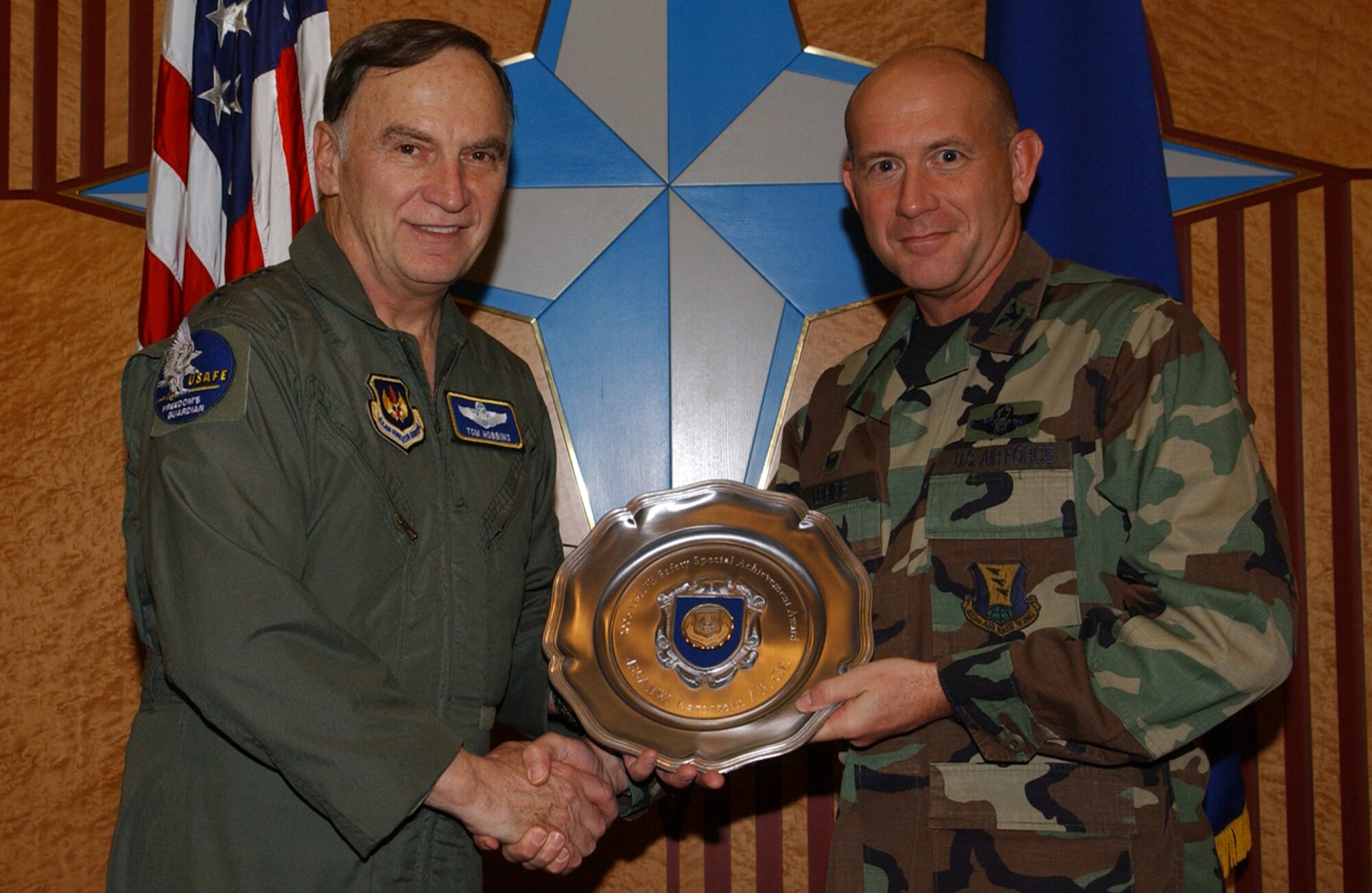 Gen. Tom Hobbins, USAFE Commander, presents Col. Kurt Lohide,(right) 435th Air Base Wing Commander with the U.S. Air Forces in Europe safety awards. 435th ABW won the USAFE Safety Special Achievement Award for promoting and achieving safety standards throughout all levels of the wings' operations.  
 
