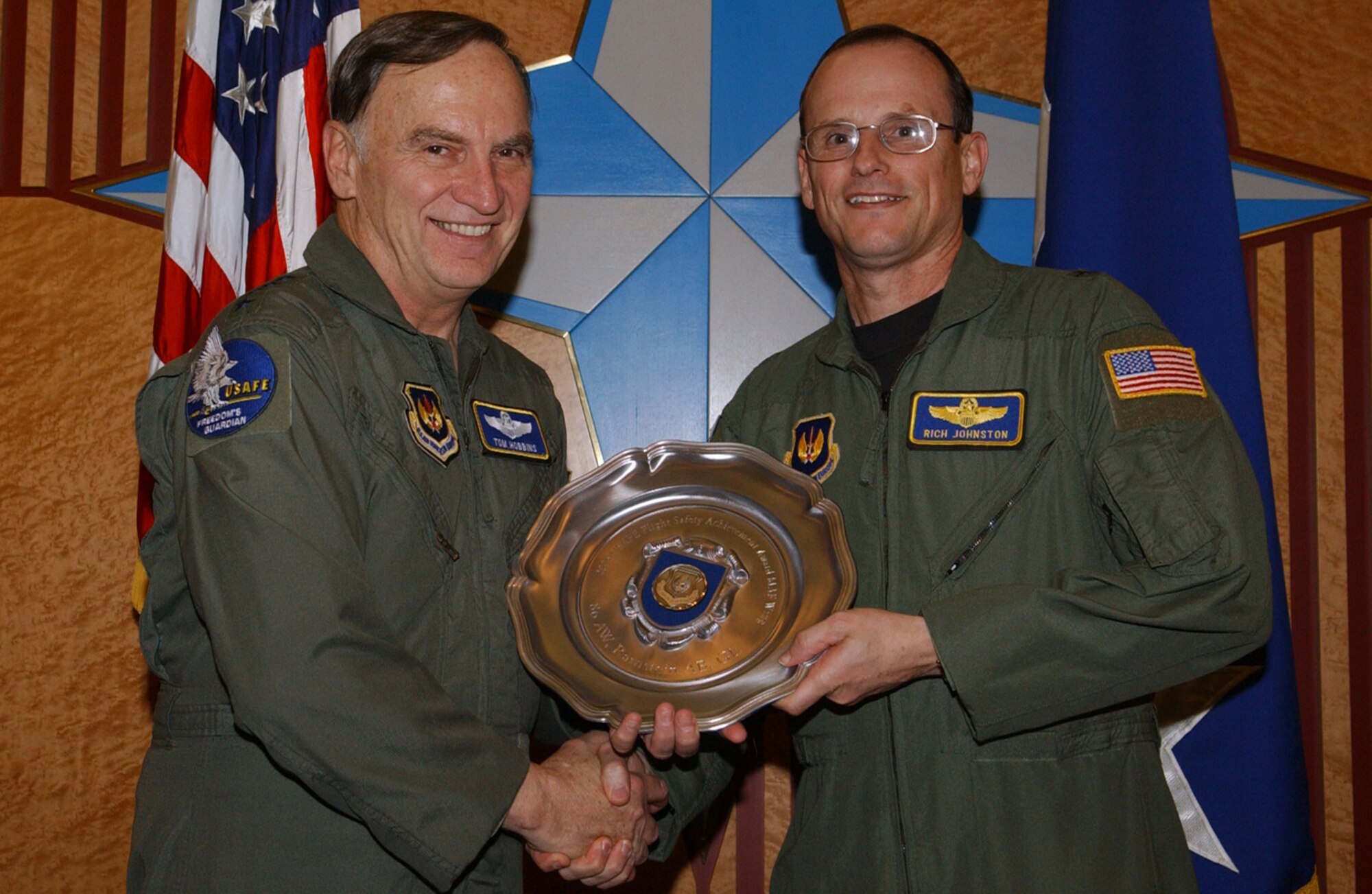Gen. Tom Hobbins, USAFE Commander, presents Brig.Gen. Richard Johnston,(right) 86th Airlift Wing Commander with the USAFE Flight Safety Achievement Award.