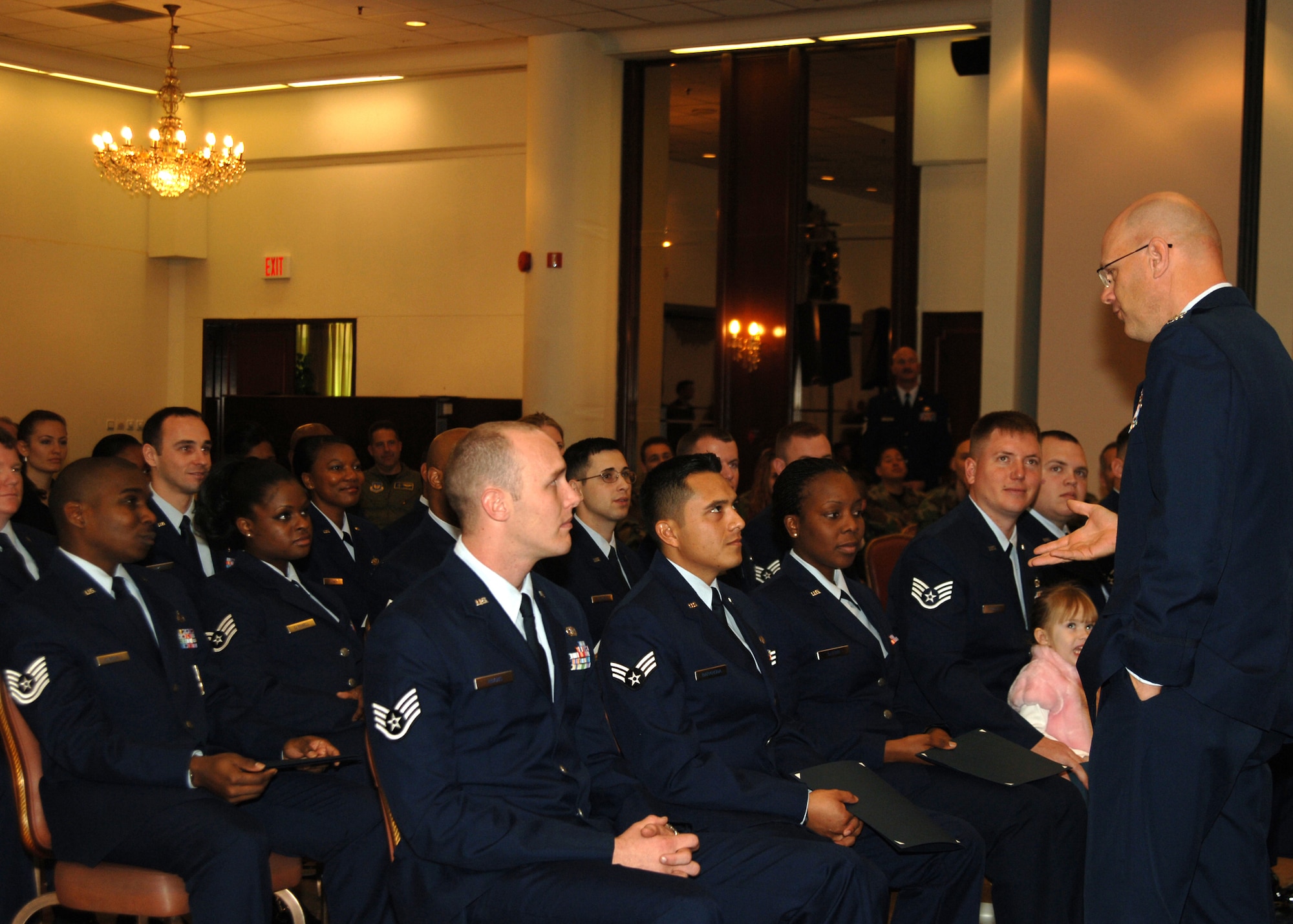 Col. Murrell "Tip" Stinnette, (right) 39th Air Base Wing commander, speaks to graduates of the Community College of the Air Force during the graduation ceremony held at the Incirlik Club Complex, Dec. 15. (U.S. Air Force photo by Airman 1st Class Kelly L. LeGuillon) 