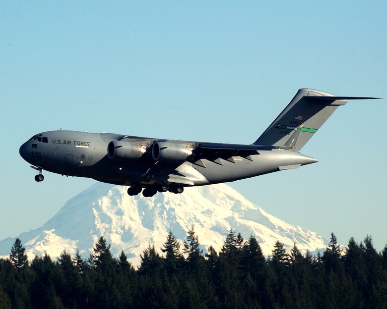 McCHORD AIR FORCE BASE, Wash., - Ten C-17s, such as this one flying past Mount Rainier here, will launch Dec. 20 in a show of team work between the active duty 62nd and Reserve 446th Airlift Wings and the various units that must pull together to accomplish the mission. (Air Force file photo by Adamarie Lewis-Page)