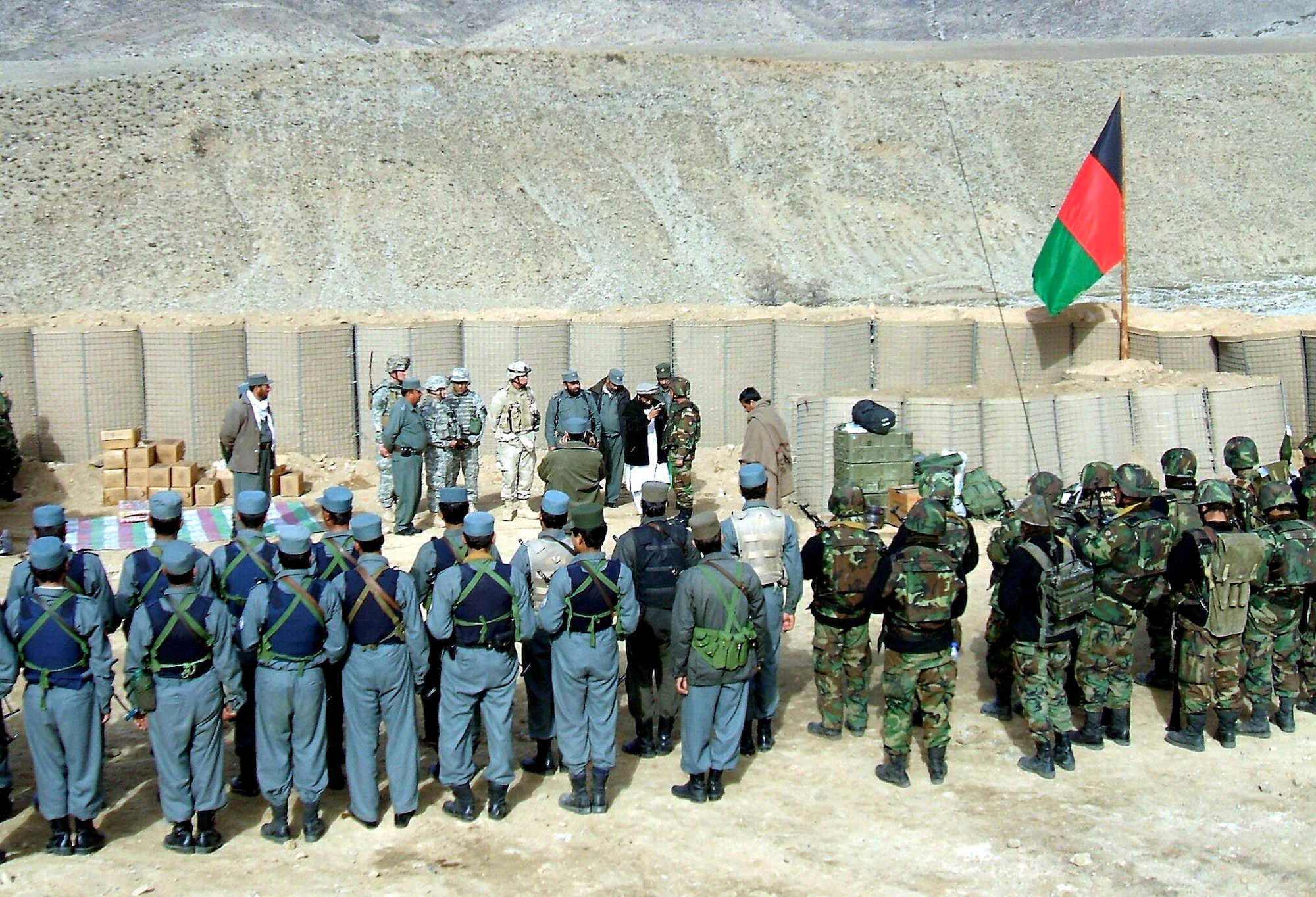 Afghan national security forces stand in formation after the flag-raising ceremony that established Security Base Najil in the Alishang Valley of Laghman Province during Operation West Hammer Dec. 12. West Hammer was aimed at defeating anti-government elements in the Alishang Valley and was carried out primarily by Task Force Chosin and the ANSF. (U.S. Army photo/Capt. Paul McCarthy)