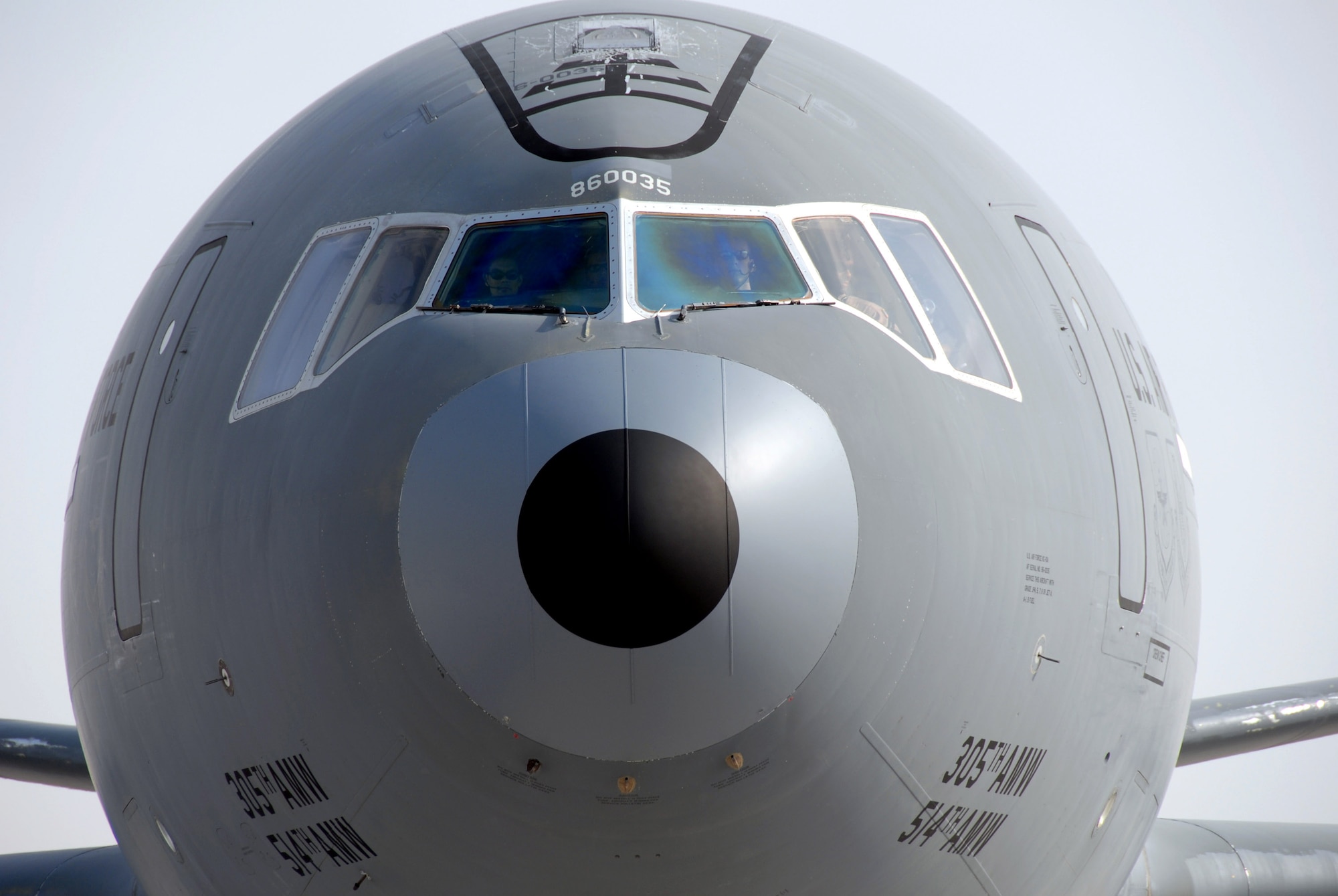 Two pilots in a KC-10 Extender from the 380th Air Expeditionary Wing pull into a parking spot Dec. 19 after returning from a mission over Iraq in support of Operation Iraqi Freedom. The air refueler is part of the largest air-refueling unit in Southwest Asia consisting of KC-10s and KC-135 Stratotankers. The KC-10 can carry about 56,000 gallons of gas, enough to fill a sport-utility vehicle 1,400 times. (U.S. Air Force photo/Master Sgt. Jason Tudor)