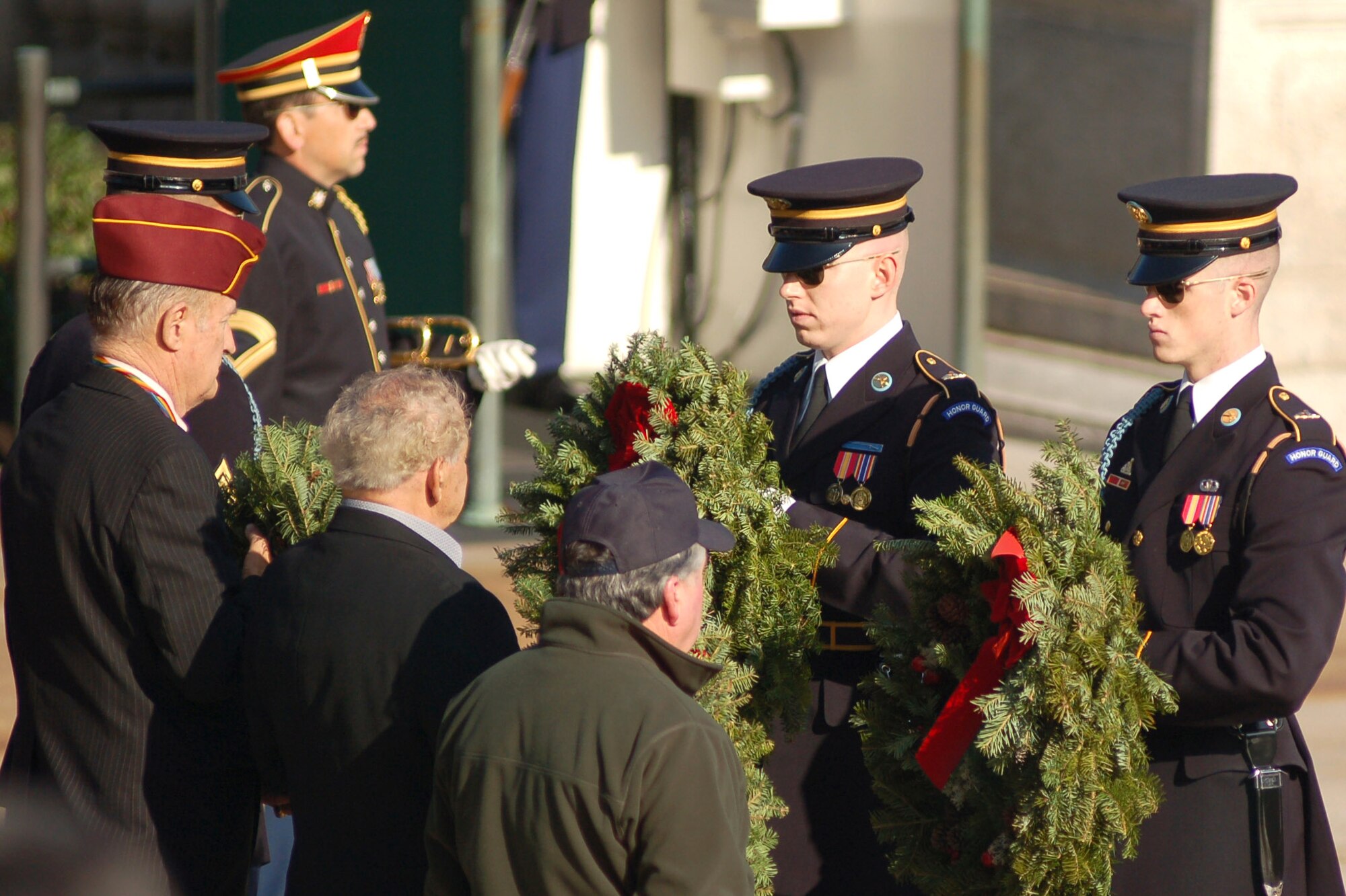 Two Soldiers receive wreaths to lay at the Tomb of the Unknown Soldier Dec. 14 in Arlington National Cemetery in Virginia. The Soldiers laid four wreaths at the tomb in an official ceremony. (U.S. Air Force photo/Senior Airman James Bolinger) 
