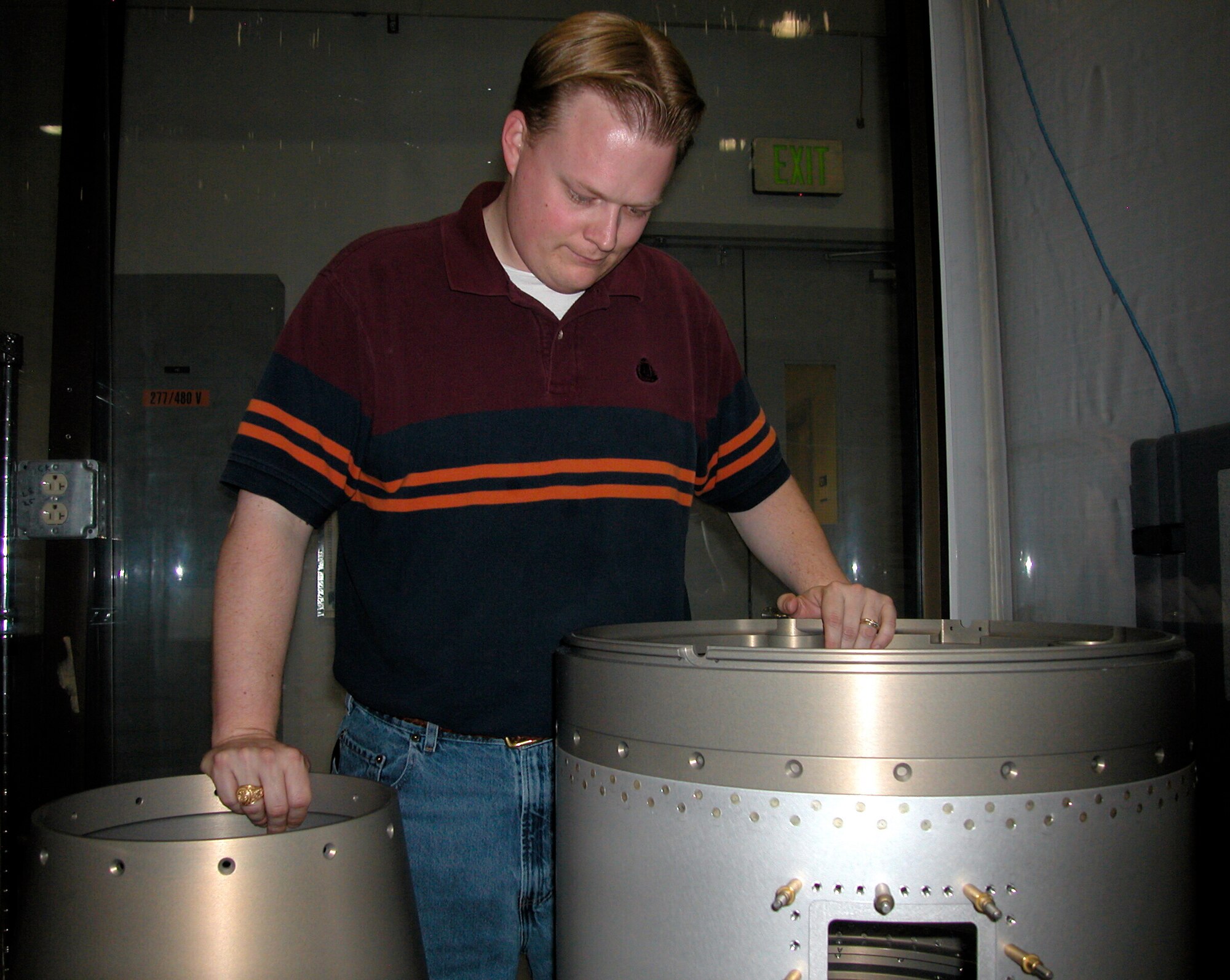 Re-Entry Structures Experiment Program Manager Andy Williams inspects the two sections comprising the five-minute trial flight, scheduled to launch from White Sands Missile Range, N.M., in December 2006. (Air Force photo by Michael P. Kleiman)