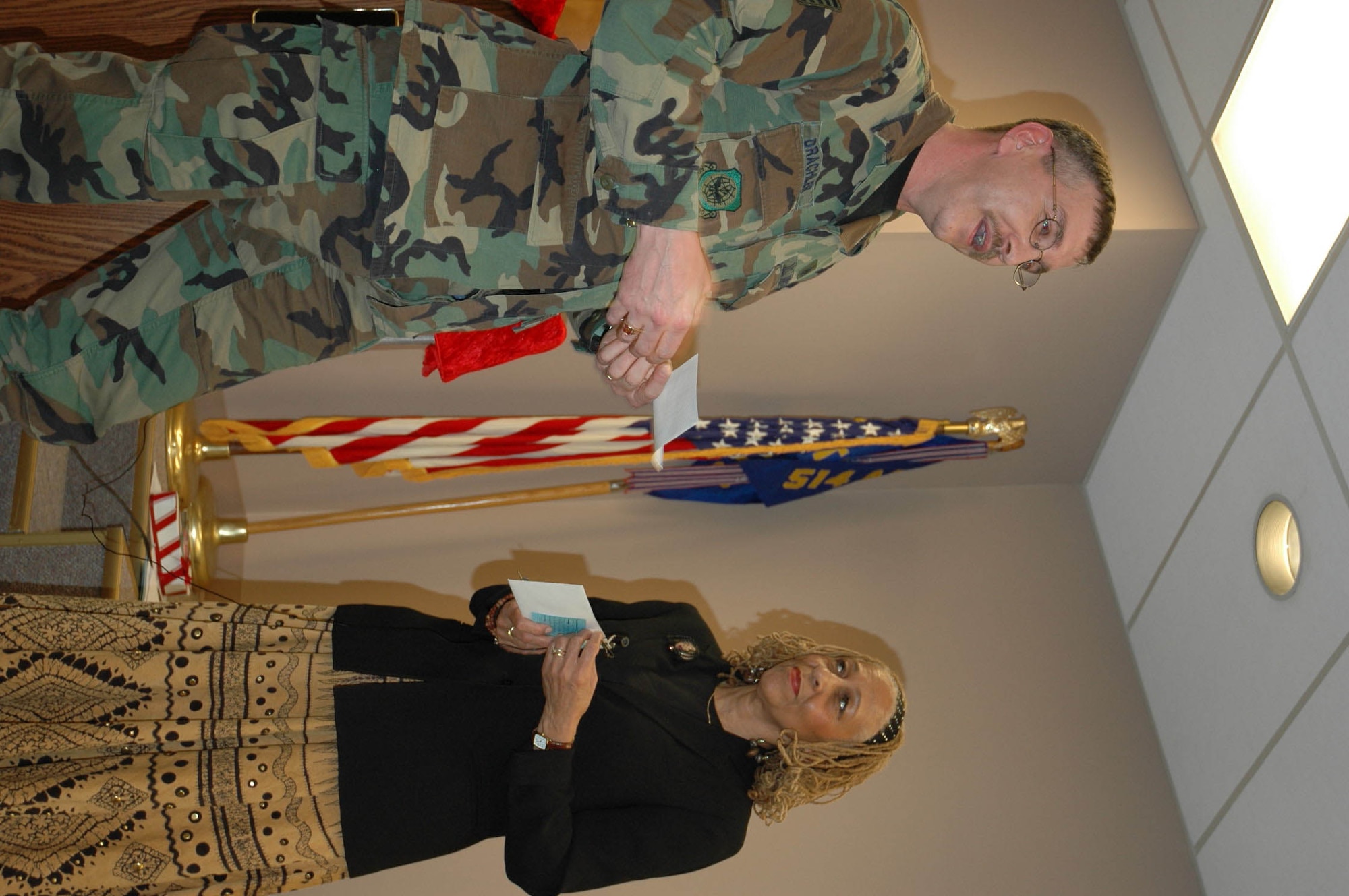 MCGUIRE AIR FORCE BASE, N.J. -- Ms. Cynthia Tyler-Mercer presents Reservist Tech. Sgt. Lenthel Drachler of the 514th Aeromedical Evacuation Squadron, $500 Saturday, as the unit's first recipient of the SMSgt. Tracy P. Tyler Memorial Scholarship. Ms. Tyler-Mercer is the mother of the late Sergeant Tyler, an Air Reserve Technician, who died May 1, two weeks after suffering a stroke..  (U.S. Air Force photo/Master Sgt. Donna T. Jeffries)