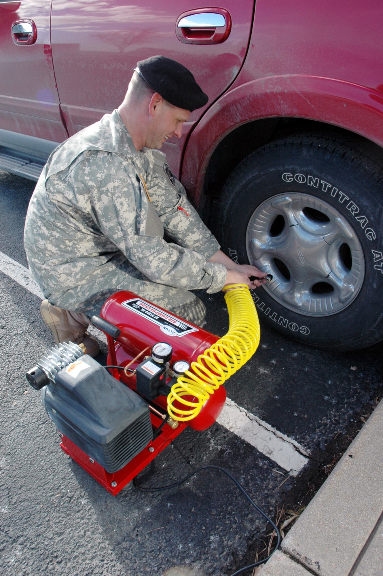 The correct tire pressure makes for a safer car. That was one of the messages from 100th Missile Defense Brigade's Safety Day that Sgt. 1st Class Richard Mach ensured Soldiers took home, literally.  (Photo by Army Maj. Laura Kenney)