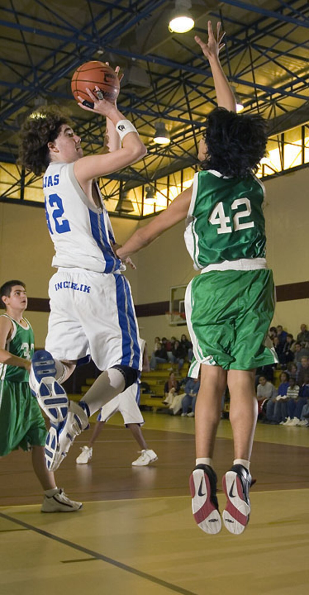 Russell Creger goes up for a jump shot Dec. 16 during a game against Ankara's high school basketball team. The Hodjas boys and girls basketball team playes Ankara's team Dec. 15 and 16 at Incirlik taking both wins by more than 40 points. (U.S. Air Force photo by Ismael Gomez)