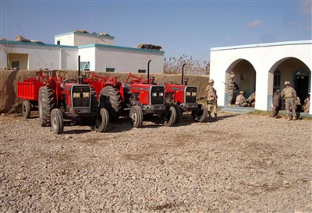 Four tractors were donated to the village of Panjwayi, Afghanistan, by the U.S. National Command Element on Dec. 10 during a ceremony at the Panjwayi District Center. 