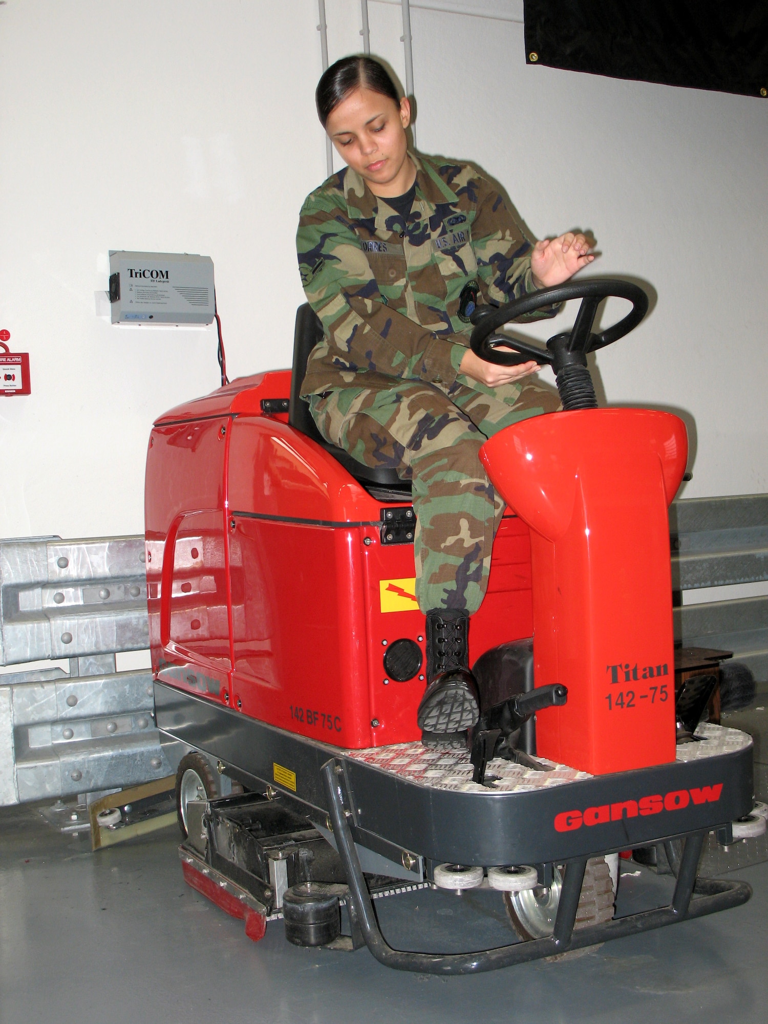 Airman Marilyn Torres starts a floor-cleaning Zamboni at Spangdahlem Air Base, Germany, Dec. 8. One of her duties as a supply apprentice is to ensure the 726th Air Mobility Squadron's Supply Warehouse floor presents a professional military image. (U.S. Air Force photo/Staff Sgt. Brandon Hoyt) 
