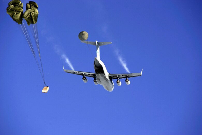 SOUTH POLE -- A C-17 Globemaster III drops pallets of cargo  during the first C-17 airdrop to the South Pole, Dec. 20, 2006. Staffed by Airmen from McChord Air Force Base's 62nd and 446th Airlift Wings, the crew delivered 70 tons of supplies to the National Science Foundation. The mission was a "proof of concept" flight. 
(U.S. Antarctic Program/Forest Banks)