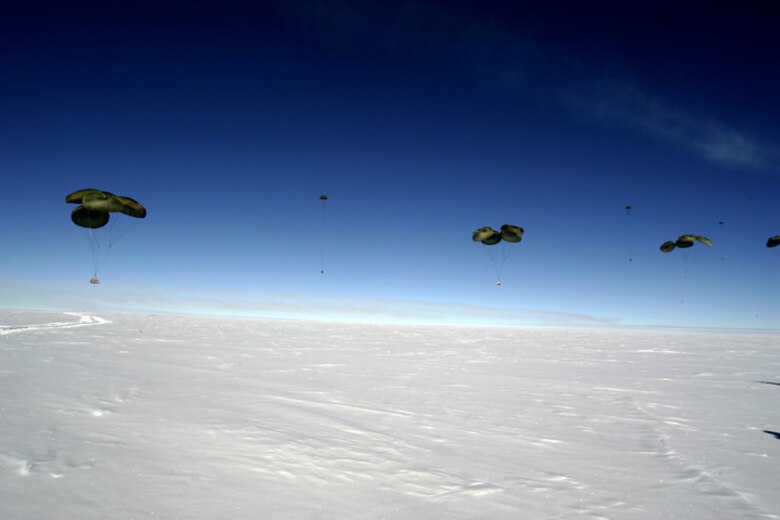 SOUTH POLE -- Pallets of cargo fall to the ice during the first C-17 Globemaster III airdrop to the South Pole, Dec. 20, 2006. Staffed by Airmen from McChord Air Force Base's 62nd and 446th Airlift Wings, the crew delivered 70 tons of supplies to the National Science Foundation. The mission was a "proof of concept" flight. 
(U.S. Antarctic Program/Forest Banks)