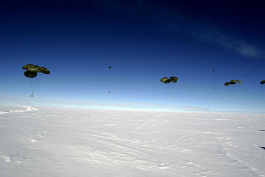 SOUTH POLE -- Pallets of cargo fall to the ice during the first C-17 Globemaster III airdrop to the South Pole, Dec. 20, 2006. Staffed by Airmen from McChord Air Force Base's 62nd and 446th Airlift Wings, the crew delivered 70 tons of supplies to the National Science Foundation. The mission was a "proof of concept" flight. 
(U.S. Antarctic Program/Forest Banks)