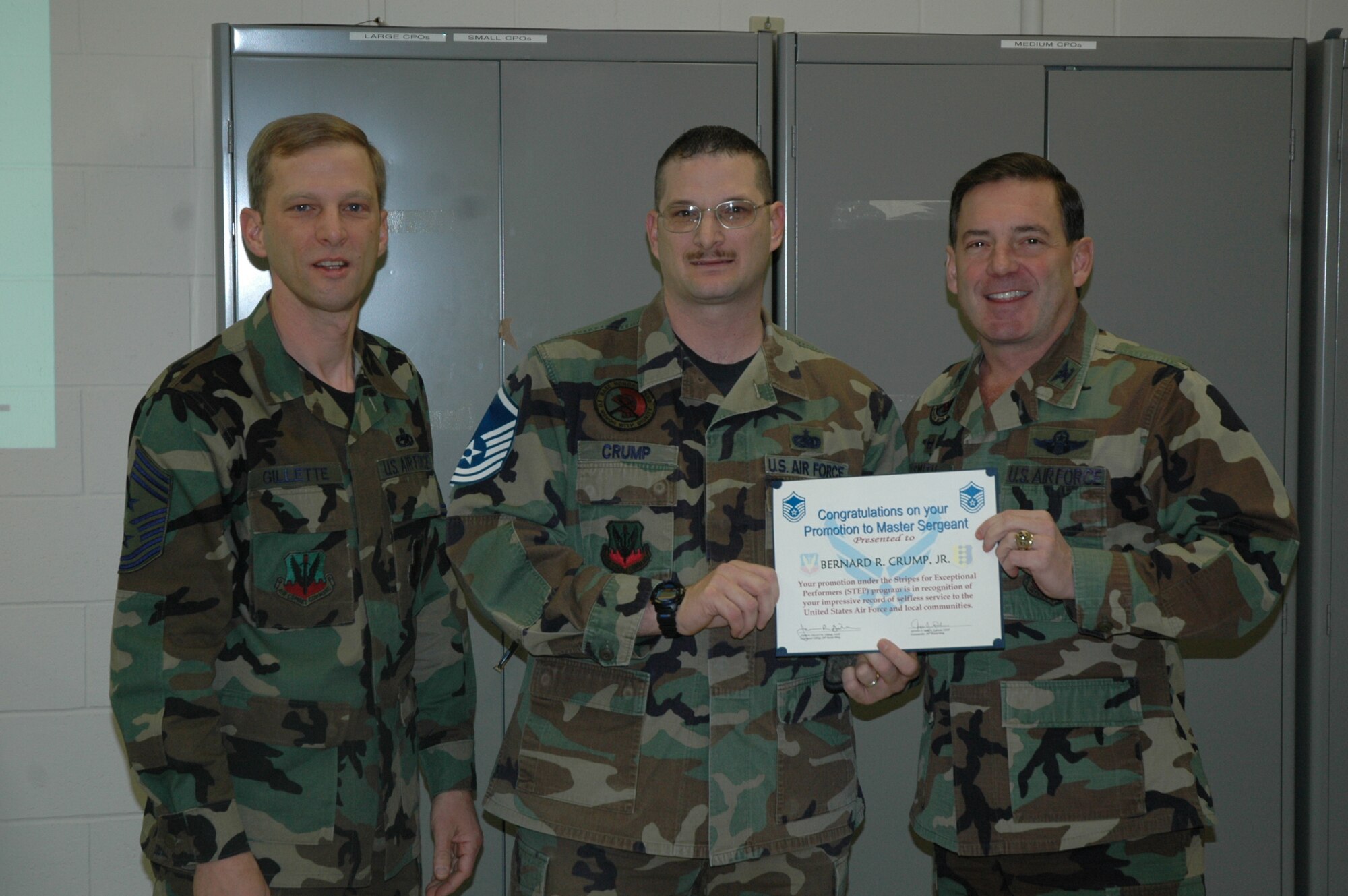 Tech. Sgt. Bernard Crump, 28th Civil Engineer Squadron, is informed by Col. Jeffry Smith, 28th Bomb Wing commander and Chief Master Sgt. John Gillette, Ellsworth command chief master sergeant, he has been selected for promotion to master sergeant under the Air Force’s stripes to exceptional performers program.