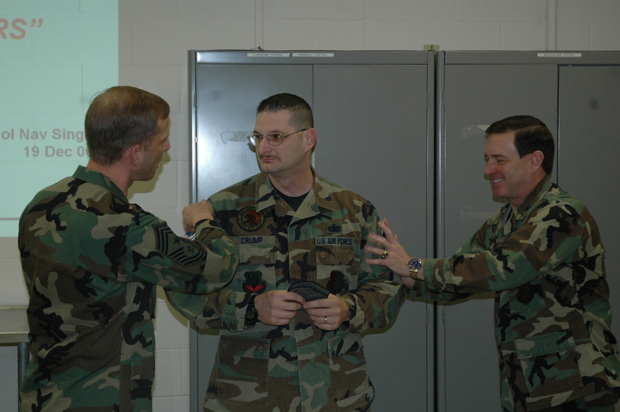 Tech. Sgt. Bernard Crump, 28th Civil Engineer Squadron, is informed by Col. Jeffry Smith, 28th Bomb Wing commander and Chief Master Sgt. John Gillette, Ellsworth command chief master sergeant, he has been selected for promotion to master sergeant under the Air Force’s stripes to exceptional performers program.