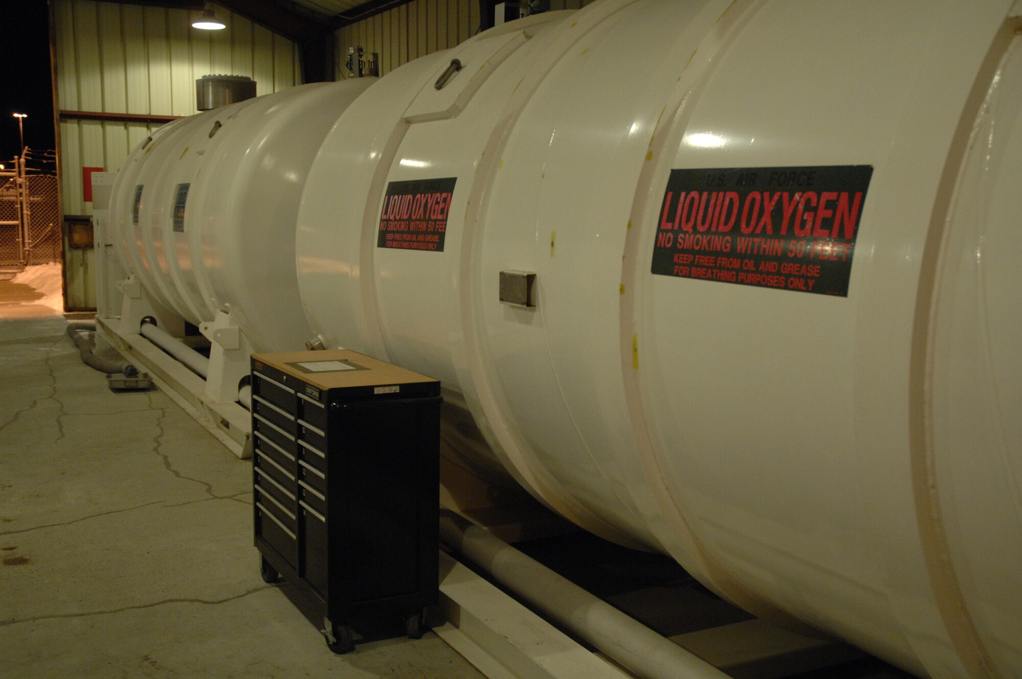 EIELSON AIR FORCE BASE, Alaska -- Tanks of Liquid Nitrogen (LIN) and Liquid Oxygen (LOX) sit in the cryogenics storage facility here on Dec 20. The LOX is used in aircraft as the breathing oxygen for pilots and the LIN is used to fill aircraft tires. Cryogenics is controlled by the 354th Logistics Readiness Squadron.
(U.S. Air Force Photo by Staff Sgt Joshua Strang)
