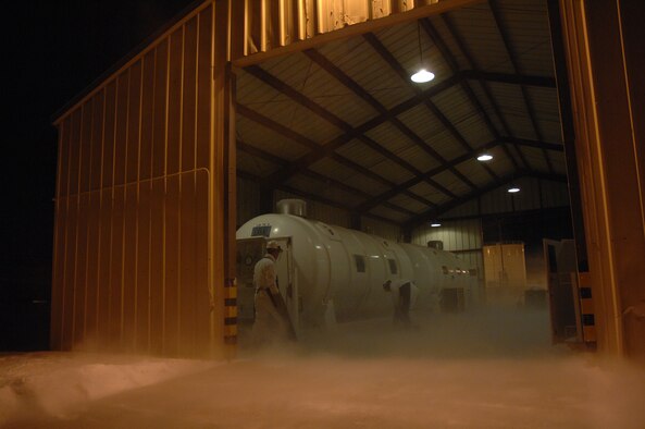 EIELSON AIR FORCE BASE, Alaska -- Airman First Class Andrew Tuttle (left) and Staff Sgt Kyle Evans, 354th Logistics Readiness Squadron, purge the Liquid Nitrogen (LIN) tube to clear any impurities that may have settled since its last use. The plume is the result of burnoff and the extremely low boiling point of the LIN.
(U.S. Air Force Photo by Staff Sgt Joshua Strang)