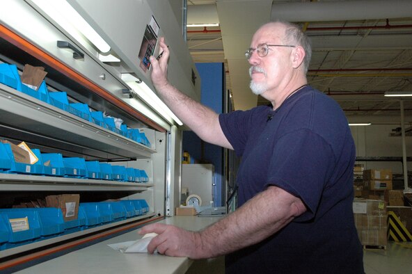 YOUNGSTOWN AIR RESERVE STATION, Ohio—Employees like Mr. Bill Baxter, a warehouse specialist with East Inc., provide critical Base Operating Support functions to the 910th Airlift Wing such as managing the base supply system.  Mr. Baxter, a resident of Howland, Ohio retired from the Air Force Reserve here in 1993 with 21 years of total military service.  He also served with the U.S. Navy during the Vietnam War from 1970-1973 while assigned to the aircraft carrier U.S.S. Forrestal.  Mr. Baxter also retired here as an employee of the federal government in 2000 after 26 years of service.  U.S. Air Force photo/Master Sgt. Bryan Ripple.