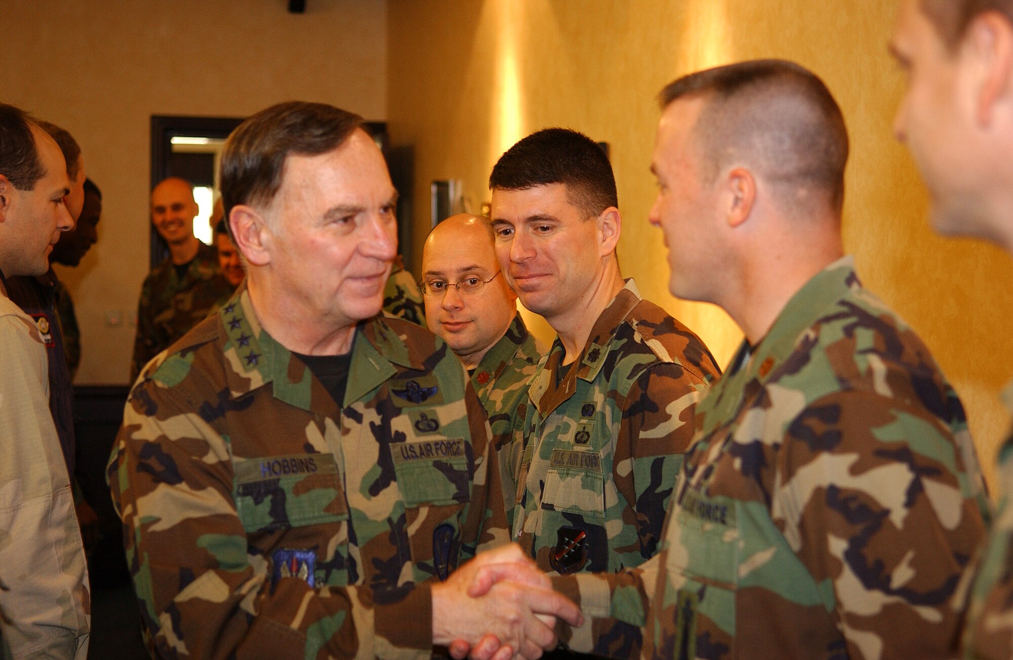 General Tom Hobbins, U.S. Air Forces in Europe commander, shakes hands with 39th Air Base Wing members after arriving here Dec. 20. General Hobbins and Chief Master Sgt. Gary Coleman, USAFE command chief, visited Team Incirlik to talk with Airmen, discuss future USAFE operations and wish every one here a happy holiday season. (U.S. Air Force photo by Staff Sgt. Chris Galindo)