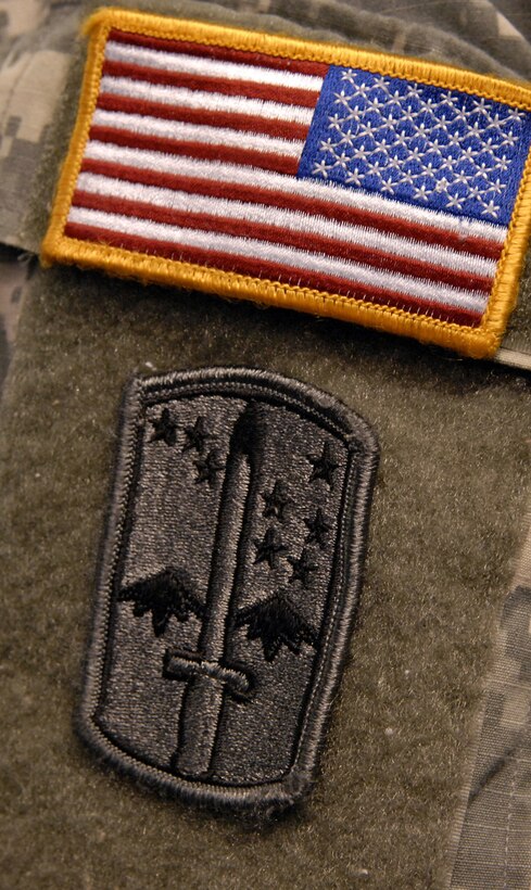 A soldier wears the 172nd Stryker Brigade Combat Team patch that will be retired during a reflagging and change of command ceremony in Fairbanks, Alaska, Dec.14, 2006. The 172nd, which returned after 16 months combat duty in Iraq, was officially redesignated the 25th Infantry Division’s 1st Stryker Brigade Combat Team.